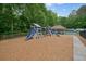 Community playground with slides and swings offers outdoor fun for children at 3267 Standing Peachtree Nw Trl, Kennesaw, GA 30152