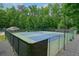 Well-maintained tennis courts surrounded by lush trees create a perfect recreational space at 3267 Standing Peachtree Nw Trl, Kennesaw, GA 30152