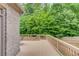 View of the back deck with a serene green backyard at 4240 Summer Breeze Way, Buford, GA 30518
