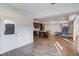 Open basement area with hard surface floors, kitchen, and white door at 4240 Summer Breeze Way, Buford, GA 30518