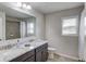 Well-lit bathroom featuring double sinks, granite countertops, and a shower-tub combo with modern fixtures at 4240 Summer Breeze Way, Buford, GA 30518