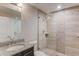 Modern bathroom features granite counters, tiled shower, and glass doors at 4240 Summer Breeze Way, Buford, GA 30518