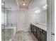 Bright bathroom featuring double vanity, soaking tub and glass enclosed shower at 4240 Summer Breeze Way, Buford, GA 30518