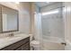 Bathroom with a large mirror, granite countertop, and shower/tub combination with tile surround at 4240 Summer Breeze Way, Buford, GA 30518