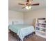 Simple bedroom includes a bed frame, bright overhead lighting, and a convenient bookshelf at 4240 Summer Breeze Way, Buford, GA 30518