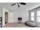 Spacious bedroom featuring neutral walls, cozy carpet, and a relaxing beanbag chair near bright windows at 4240 Summer Breeze Way, Buford, GA 30518