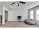 Upstairs bonus room featuring carpet, natural light, and a ceiling fan and tv, great for entertaining at 4240 Summer Breeze Way, Buford, GA 30518