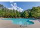 Community pool featuring lounge chairs, umbrellas, and pristine water, perfect for relaxation at 4240 Summer Breeze Way, Buford, GA 30518