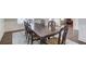 Dining room featuring wainscoting and hardwood floors, connecting seamlessly with adjacent spaces at 4240 Summer Breeze Way, Buford, GA 30518