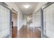 Inviting foyer with hardwood floors, neutral walls, classic trim, and an open view of the staircase at 4240 Summer Breeze Way, Buford, GA 30518