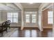 Inviting foyer with wainscoting, coffered ceiling, and a double-door entryway at 4240 Summer Breeze Way, Buford, GA 30518