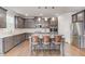 Stylish kitchen with stainless steel appliances, granite countertops, pendant lights, and a kitchen island at 4240 Summer Breeze Way, Buford, GA 30518