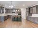 Large kitchen with stainless steel appliances, granite countertops, and a central island with seating at 4240 Summer Breeze Way, Buford, GA 30518