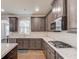 Modern kitchen with stainless steel appliances, gas cooktop, granite countertops, and ample cabinet space at 4240 Summer Breeze Way, Buford, GA 30518