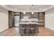 Kitchen includes stainless steel appliances, granite counters, and a center island at 4240 Summer Breeze Way, Buford, GA 30518