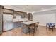 Stylish kitchen features stainless steel appliances, gray cabinets, and a center island at 4240 Summer Breeze Way, Buford, GA 30518