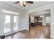 Open living room concept with kitchen access and access to the deck with plenty of natural light at 4240 Summer Breeze Way, Buford, GA 30518