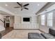 Living room with custom built-in shelving and cabinets and recessed lighting at 4240 Summer Breeze Way, Buford, GA 30518