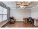 Living room features a coffered ceiling, ceiling fan and large window for great light at 4240 Summer Breeze Way, Buford, GA 30518