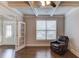 Living room features a coffered ceiling, ceiling fan and is adjacent to the foyer at 4240 Summer Breeze Way, Buford, GA 30518