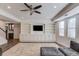 Open living room with hard surface flooring and custom built-ins at 4240 Summer Breeze Way, Buford, GA 30518