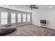 Large living room with carpet, ceiling fan and large window at 4240 Summer Breeze Way, Buford, GA 30518