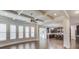 Open-concept living room with views of the kitchen and multiple windows for natural light at 4240 Summer Breeze Way, Buford, GA 30518