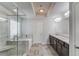 Beautiful main bathroom with a double vanity, separate shower and soaking tub, and modern lighting fixtures at 4240 Summer Breeze Way, Buford, GA 30518