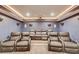 Home theater room with reclining chairs and custom lighting at 4240 Summer Breeze Way, Buford, GA 30518