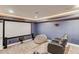 Home theater room with screen, speakers, and a lounge chair at 4240 Summer Breeze Way, Buford, GA 30518