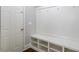 Mudroom with built in cubbies and hanging hooks for storage when entering from the garage, and an exterior door at 4240 Summer Breeze Way, Buford, GA 30518