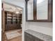 Office area featuring custom built-ins, granite counters, and an elegant display cabinet at 4240 Summer Breeze Way, Buford, GA 30518