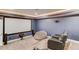 A home theater features a large screen, comfortable seating, and cozy lighting at 4240 Summer Breeze Way, Buford, GA 30518