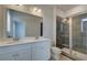 Modern bathroom features double vanity, large mirror, and glass-enclosed shower at 533 Rubato Knl, Mcdonough, GA 30253