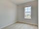 Cozy bedroom with large window, offering natural light and scenic views at 533 Rubato Knl, Mcdonough, GA 30253