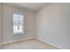 Bright bedroom features a large window and light wood-look flooring at 533 Rubato Knl, Mcdonough, GA 30253