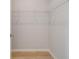 Walk-in closet features wire shelving and light hardwood floors at 533 Rubato Knl, Mcdonough, GA 30253