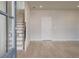 Inviting entryway with hardwood floors, stairs, and ample natural light coming through the door at 533 Rubato Knl, Mcdonough, GA 30253