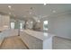 Spacious kitchen featuring a large island, stainless steel appliances, and pendant lighting at 533 Rubato Knl, Mcdonough, GA 30253