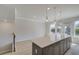 Contemporary kitchen features gray cabinets, white countertops, and a door leading to a deck at 533 Rubato Knl, Mcdonough, GA 30253