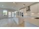 Bright, modern kitchen with stainless steel appliances, pendant lighting, and a large center island at 533 Rubato Knl, Mcdonough, GA 30253