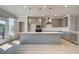 Modern kitchen boasts stainless steel appliances, a large island, and plenty of counter space at 533 Rubato Knl, Mcdonough, GA 30253