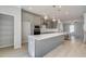 Modern kitchen features gray cabinets, stainless appliances, a large island, and an open floor plan at 533 Rubato Knl, Mcdonough, GA 30253