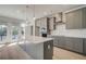 Modern kitchen boasts stainless steel appliances, a large island, and plenty of counter space at 533 Rubato Knl, Mcdonough, GA 30253