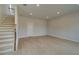 Bright living space featuring light wood flooring, recessed lighting, and a staircase, creating a spacious atmosphere at 533 Rubato Knl, Mcdonough, GA 30253