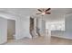 Spacious living room with a view of the staircase, kitchen, and bathroom, all with neutral paint at 533 Rubato Knl, Mcdonough, GA 30253