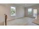Inviting room with ample natural light from two windows and access to a balcony at 533 Rubato Knl, Mcdonough, GA 30253