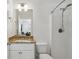 Clean bathroom with white vanity, a toilet, and a shower featuring a silver shower head at 600 Luckett Ct, Smyrna, GA 30080