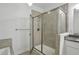 The bathroom has gray tile, an open glass shower, white cabinets, and a granite countertop at 600 Luckett Ct, Smyrna, GA 30080