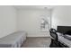 Spare bedroom or office area featuring neutral colored walls, gray carpet and lots of natural light at 600 Luckett Ct, Smyrna, GA 30080